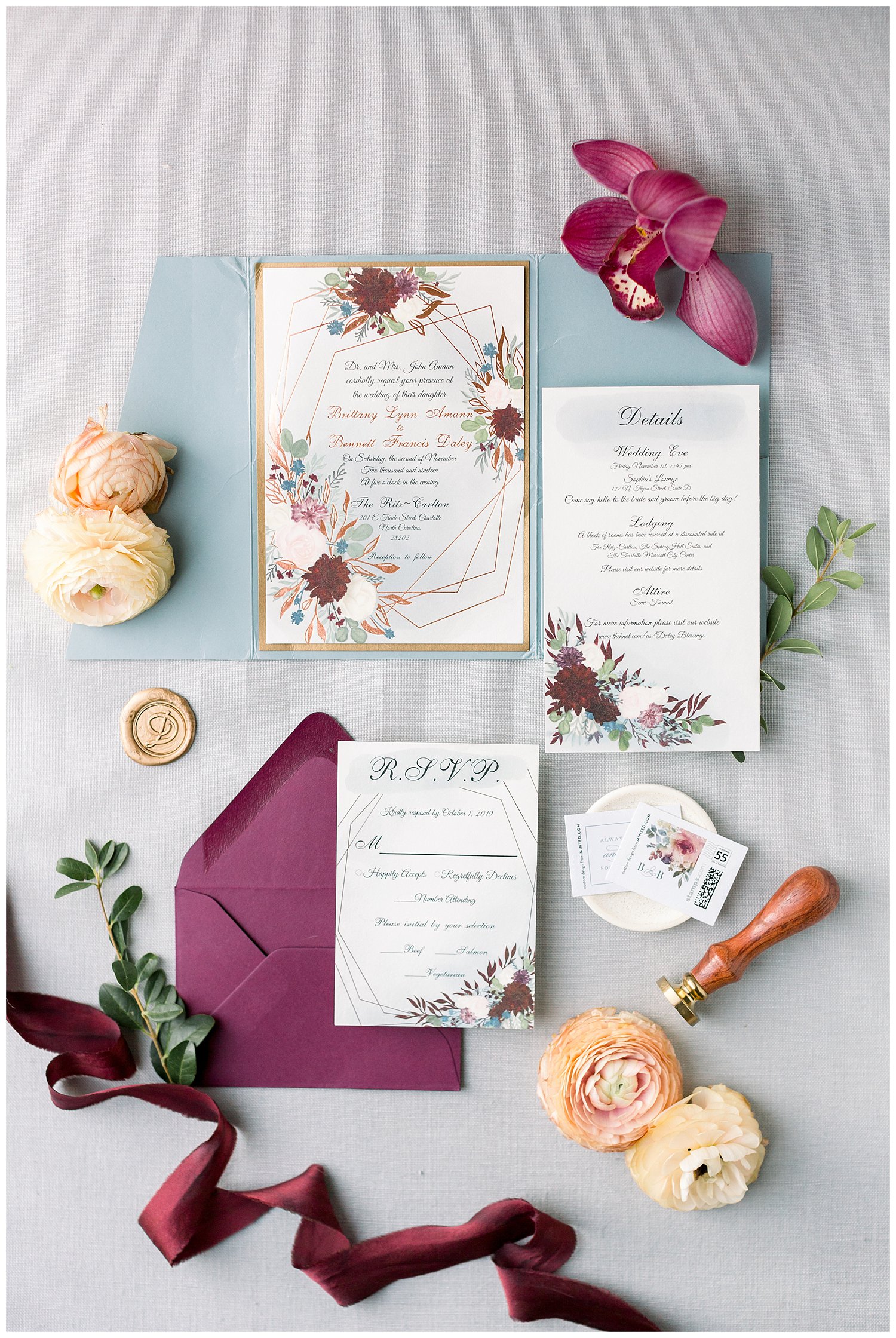 Blue and burgundy wedding invitation suite with wax seal